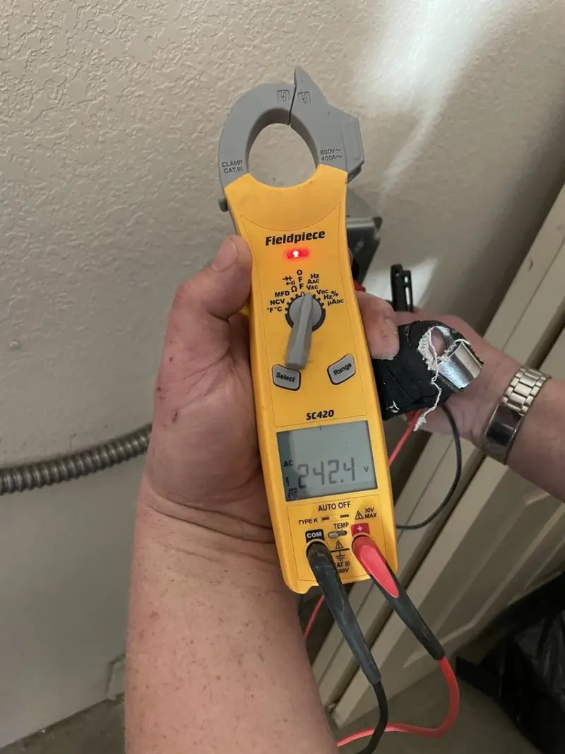 Voltage testing with clamp meter during Aluminum Wiring Replacement in Lakes of the Four Seasons